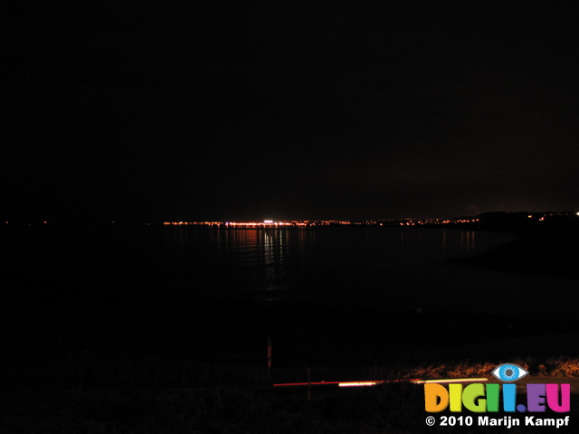 SX17014 View to Porthcawl at night from Ogmore river mouth